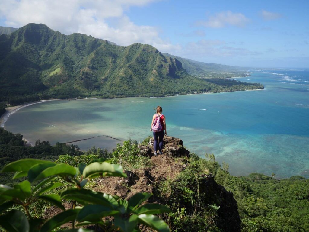 Image of a woman hiking on a mountain in Kaaawa Oahu