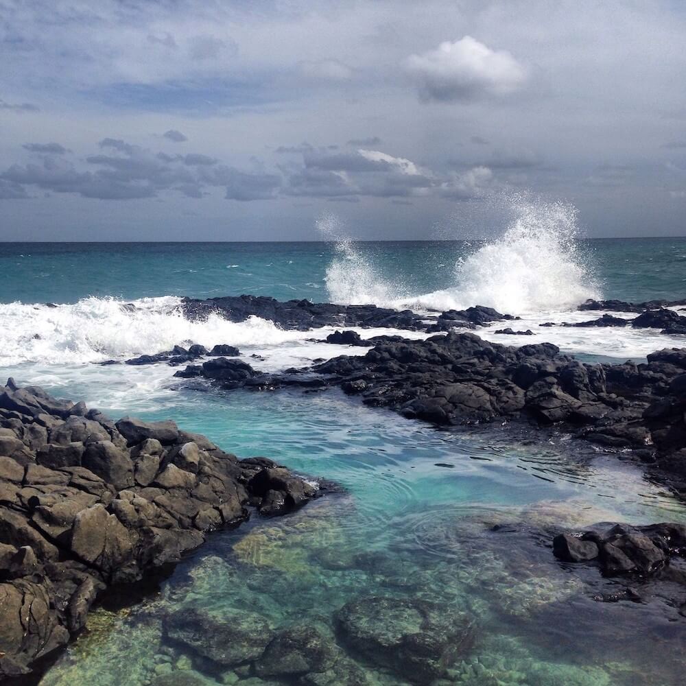 Image of a tidepool with teal water