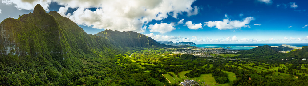 Image of a panoramic view of Oahu's mountains, valley, and a little sliver of ocean in the background