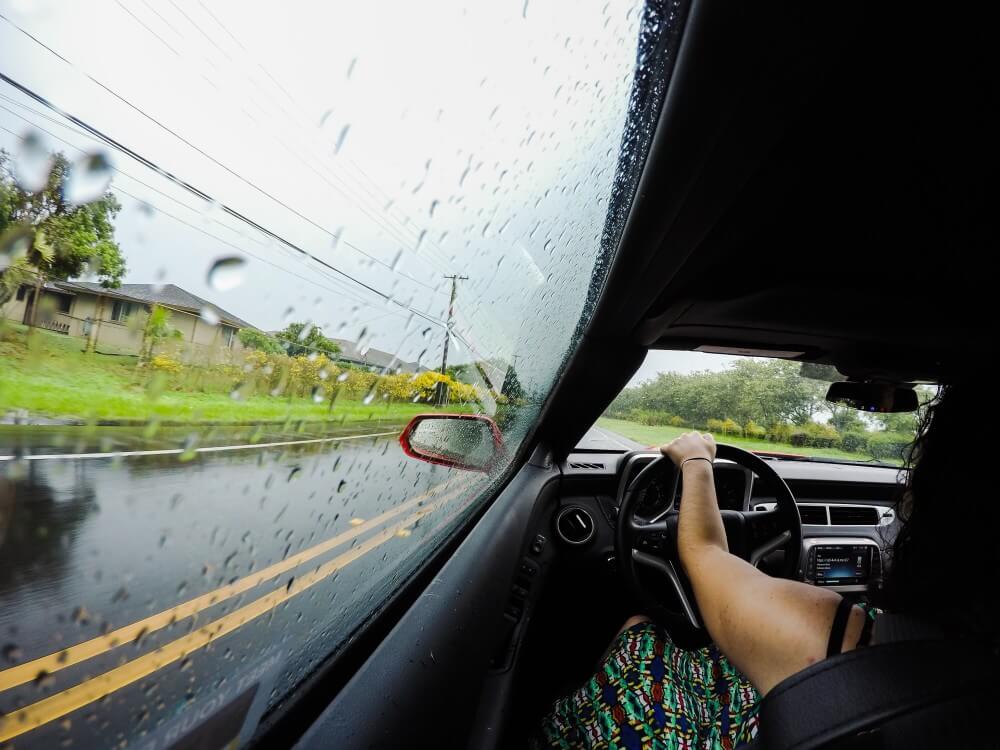 Image of someone driving a car in the rain on Kauai