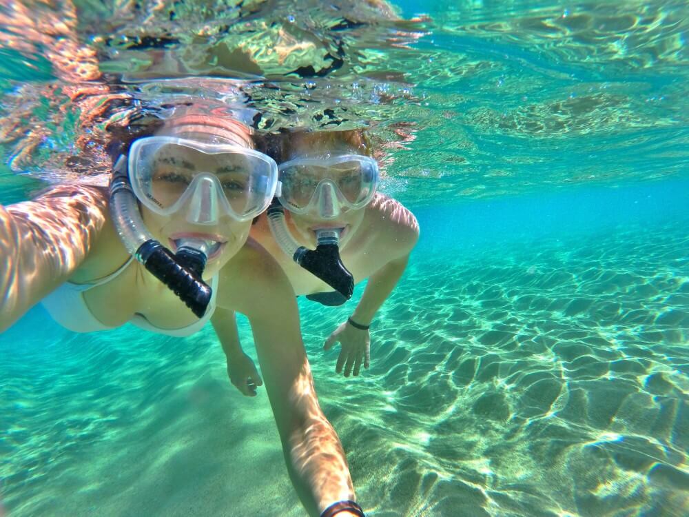 Image of a couple snorkeling in the ocean