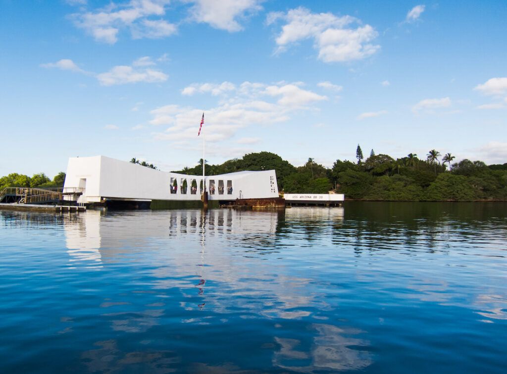 Image of the USS Arizona Memorial on the water at Pearl Harbor on Oahu