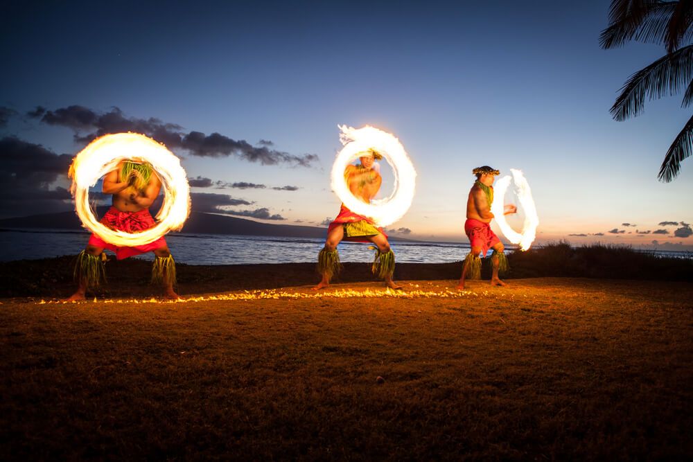 Image of Hawaiian fire dancers on the beach in Hawaii at sunset