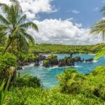 Find out all the best things to do in Hana Maui recommended by top Hawaii blog Hawaii Travel Spot! Image of Waianapanapa State Park, home to a black beach, a popular destination on the Road to Hana on Maui, Hawaii