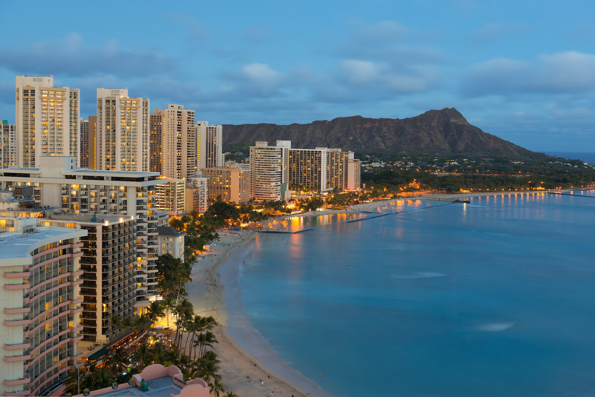 Find out the best things to do in Honolulu at night recommended by top Hawaii blog Hawaii Travel Spot! Image of Waikiki and Diamond Head at night