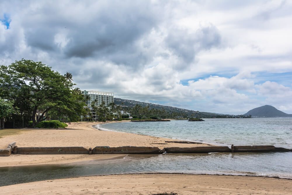 Waialae Beach on Oahu. Image of a beach on an overcast day.