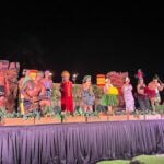 How to Choose the Best Luau on Kauai: Image of Polynesian dancers at the Aulii Luau on Kauai. Photo credit: Marcie Cheung publisher of HawaiiTravelSpot.com