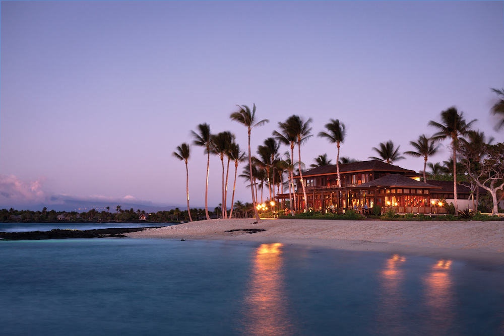 Four Seasons Hualalai: Image of a resort on the beach at sunset