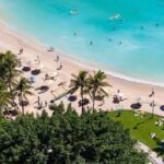Check out this guide to Hawaii in October by top Hawaii blog Hawaii Travel Spot! Image of a beach on Oahu as seen from an Oahu hotel