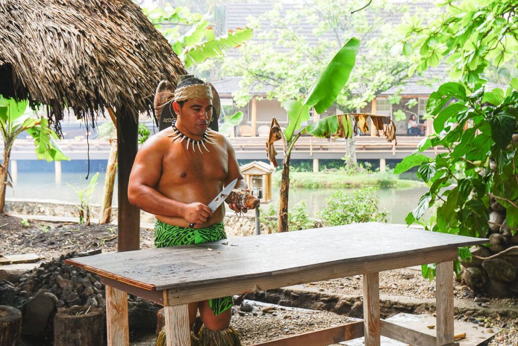 Image of a Samoan guy doing a cooking demonstration