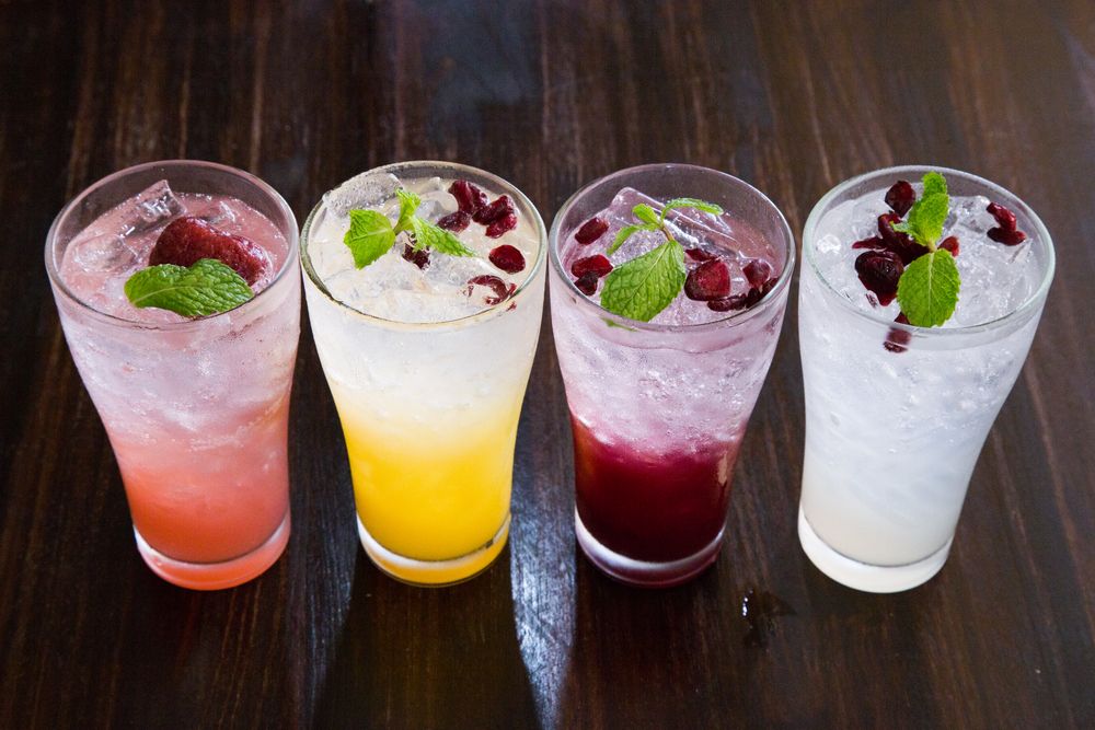 Image of Four Mai Tai cocktails in a club on a bar counter.