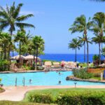 Find out the best areas to stay on Maui recommended by top Hawaii blog Hawaii Travel Spot! Image of a Maui resort pool.