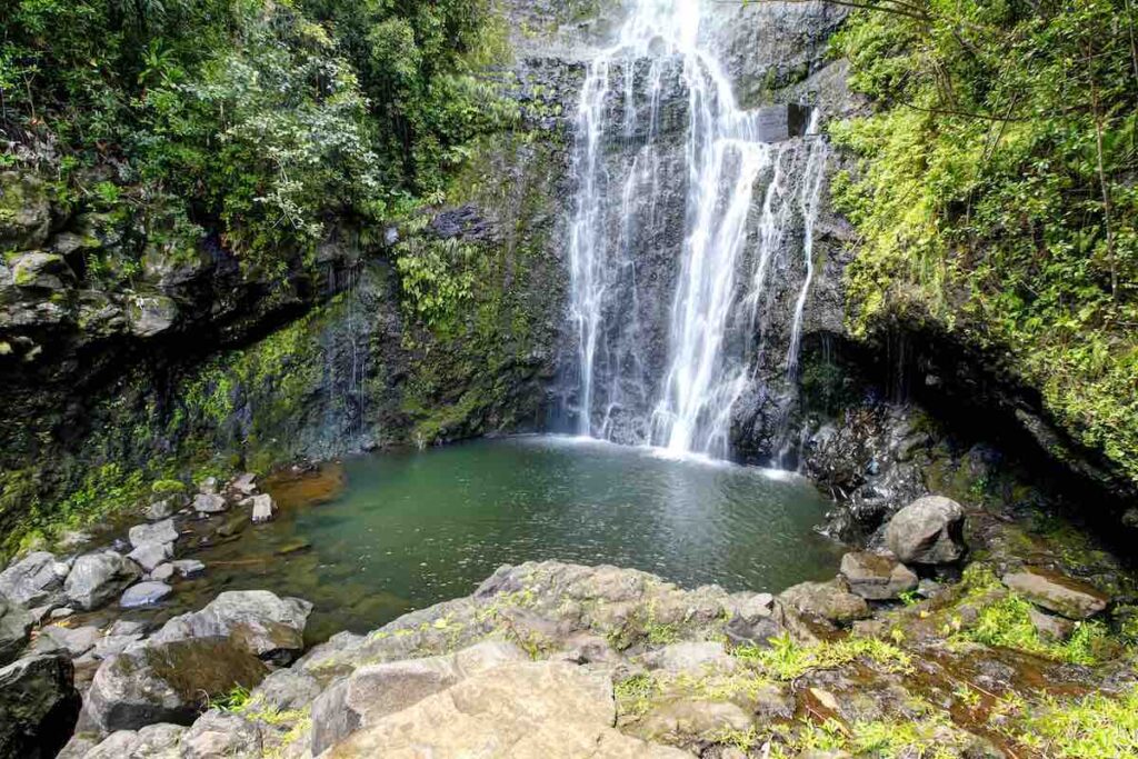 Check out this list of the best Maui waterfalls recommended by top Hawaii blog Hawaii Travel Spot! Image of a waterfall in Maui