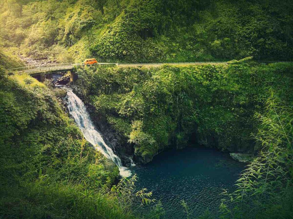 Find out the best stops on the Road to Hana recommended by top Hawaii blog Hawaii Travel Spot. Image of Makapipi Falls on the Road to Hana Maui