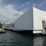Find out how to get from Waikiki to Pearl Harbor on Oahu by top Hawaii blog Hawaii Travel Spot. Image of USS Arizona Memorial Pearl Harbor Hawaii. Positioned directly over the remains of the ship that continues to release oil.