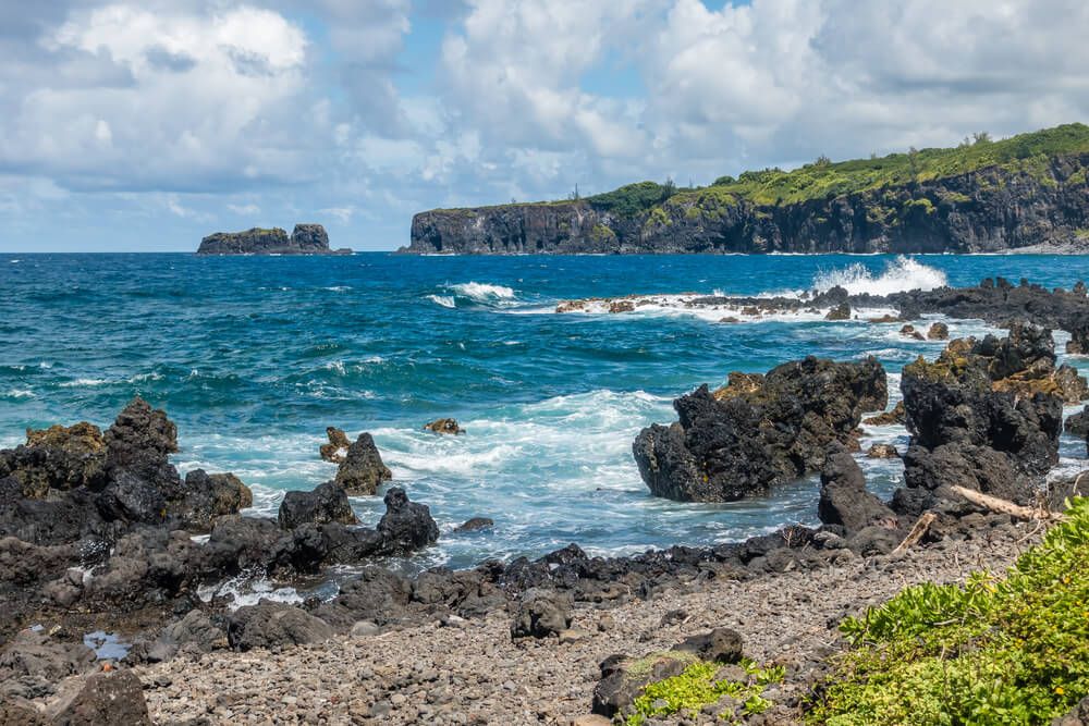 Keanae Penninsula is one of the best Road to Hana stops. Image of a rocky shoreline on Maui