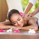 Find out the best spas in Oahu Hawaii recommended by top Hawaii blog Hawaii Travel Spot! Image of Smiling woman enjoying a massage, back massage
