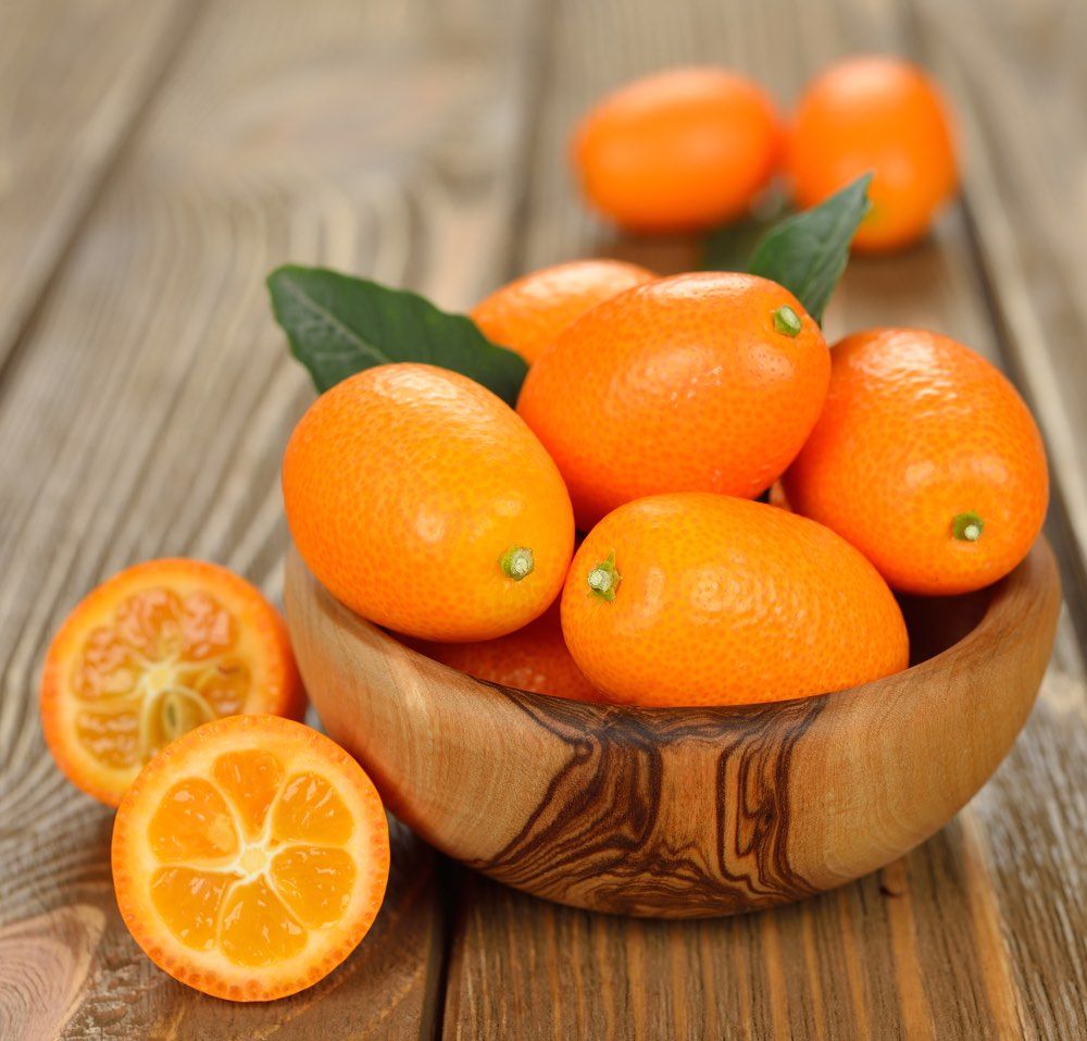 kumquat on brown background closeup