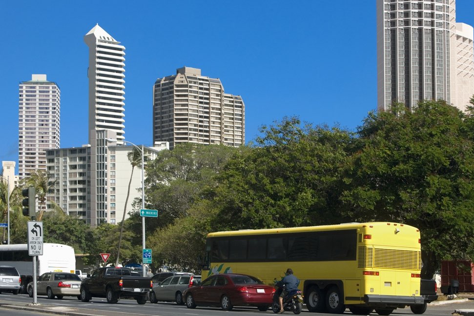 Image of traffic in Honolulu including shuttle buses