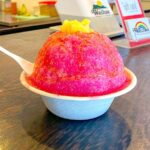 Check out the best shave ice on Kauai recommended by top Hawaii blog Hawaii Travel Spot! Image of pink shave ice from Wailua Shave Ice. Photo credit: Marcie Cheung publisher of HawaiiTravelSpot.com