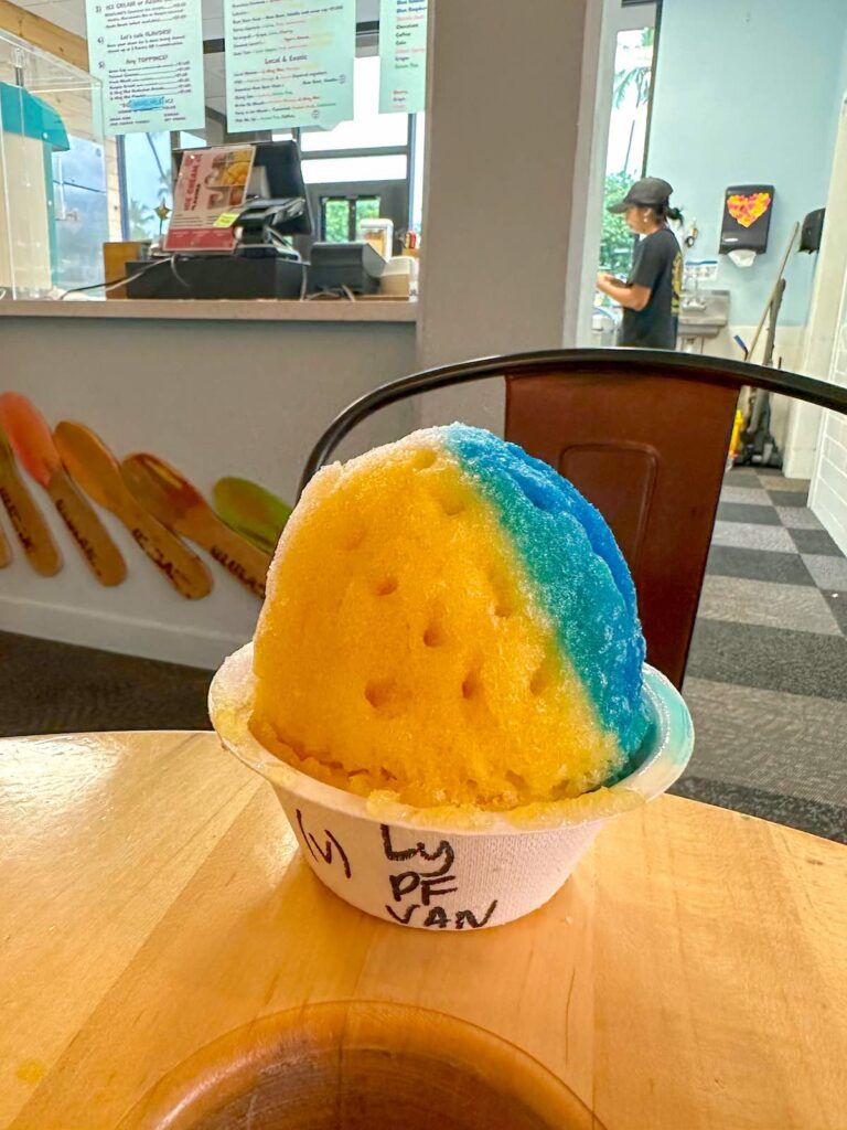 Image of a blue and yellow shave ice at Ululani Shave Ice in Kona