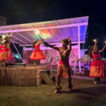 Check out this honest Diamond Head Luau review in Waikiki by top Hawaii blog Hawaii Travel Spot. Image of hula dancers performing with fire at Diamond Head Luau on Oahu. Photo credit: Marcie Cheung