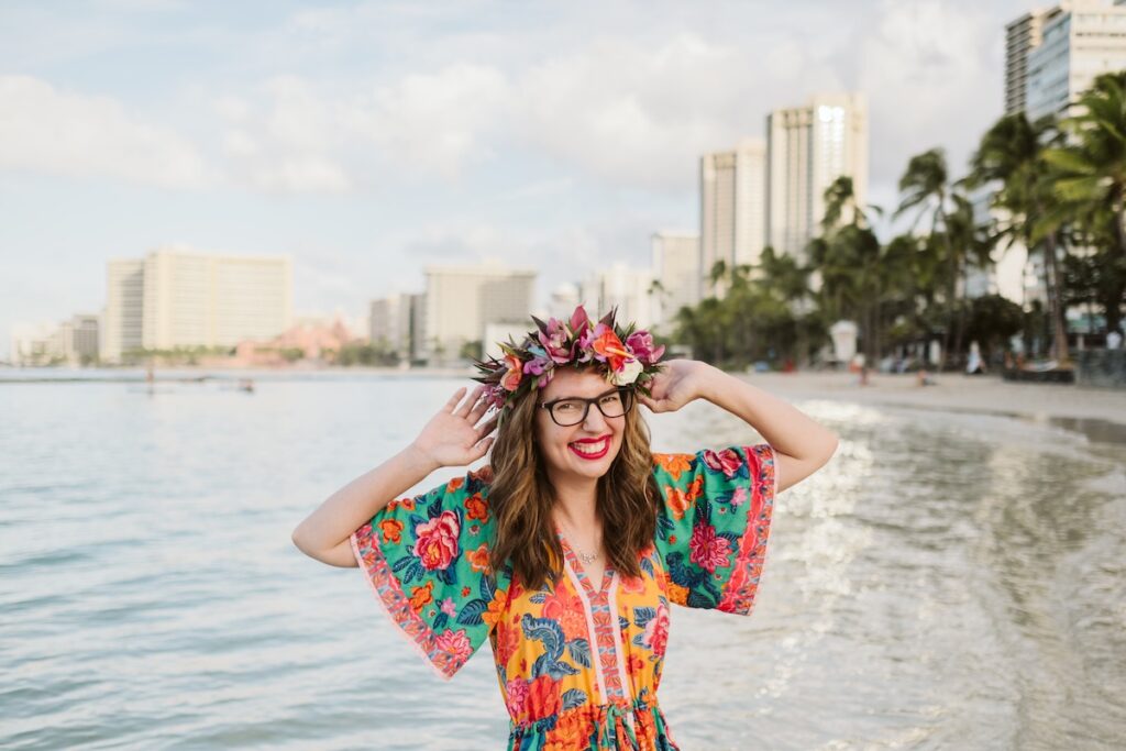 Image of Marcie Cheung of Hawaii Travel Spot posing for a Waikiki photographer. Photo credit: Natalie with Flytographer
